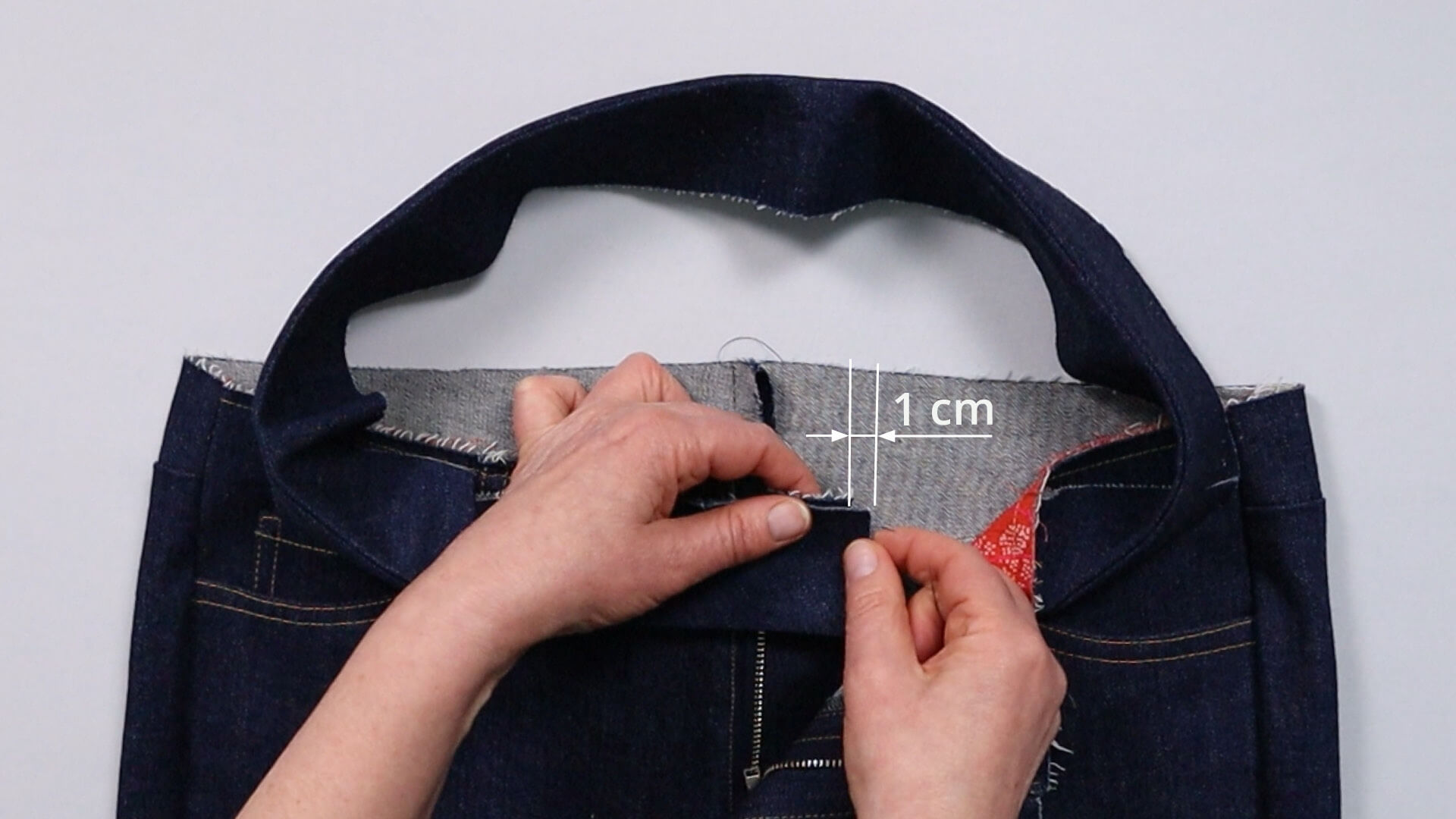 The picture shows the waistband overhang on the right-hand side.