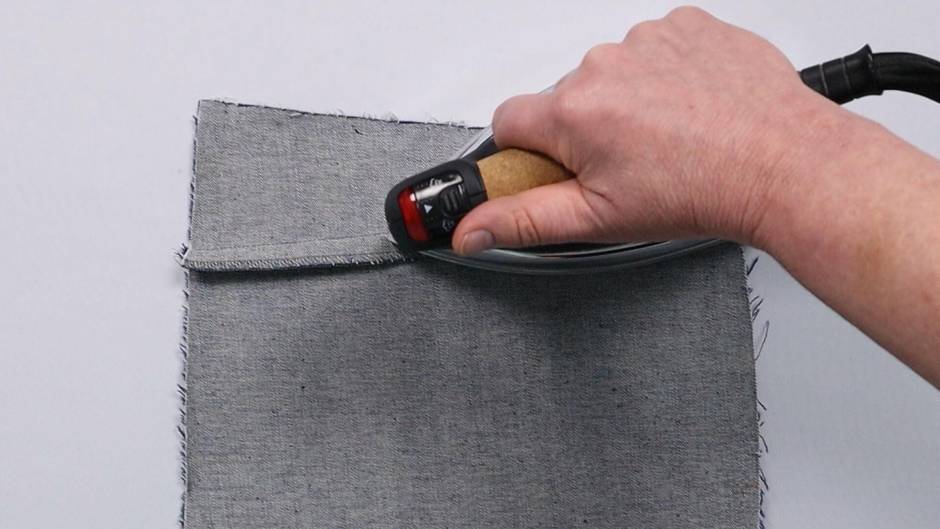The picture shows how the saddle seam is ironed.