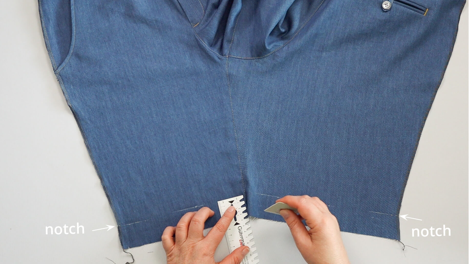 The picture shows how the finished hem edge is marked.