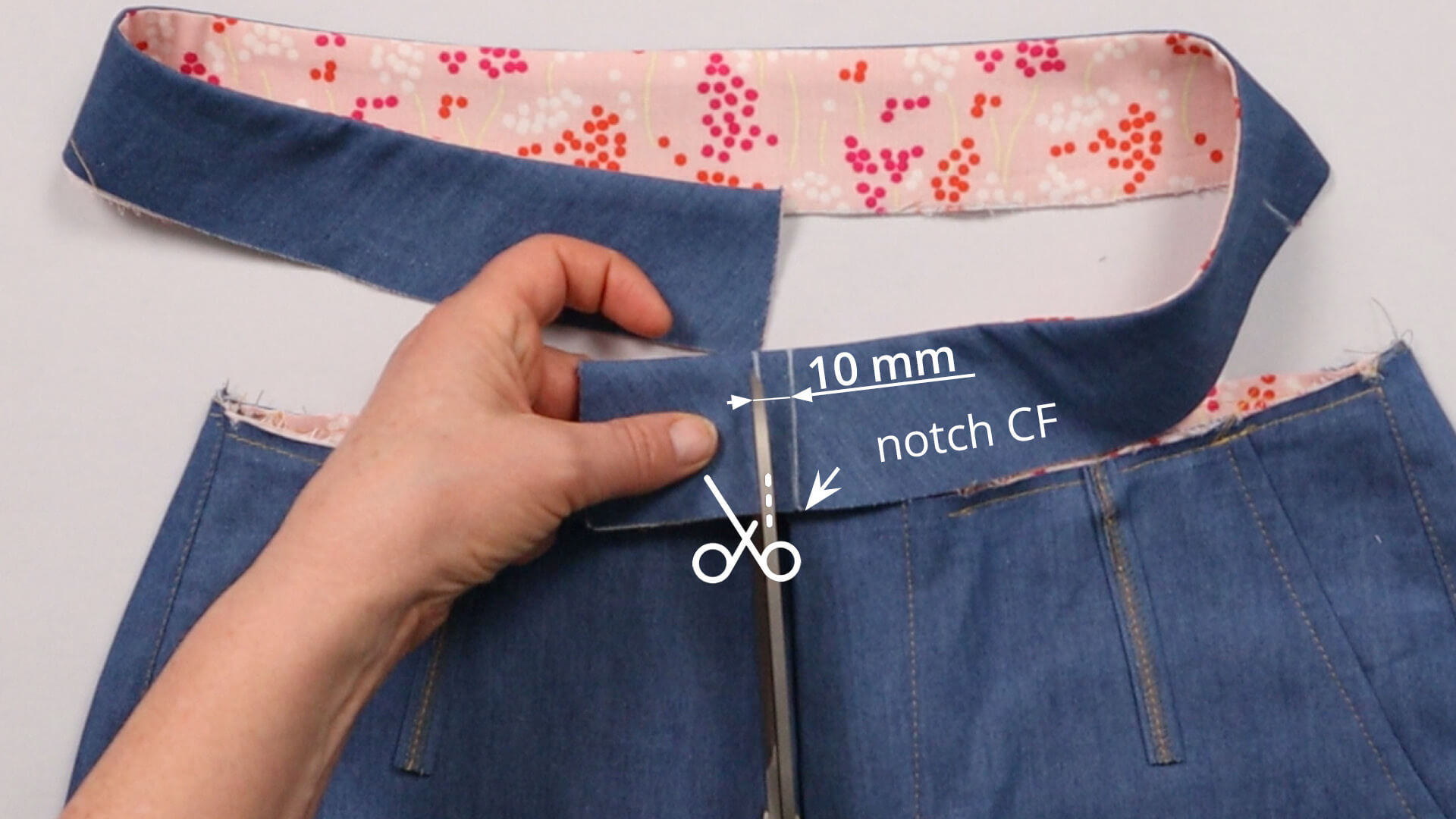 The picture shows where the left side of the waistband can be shortened.