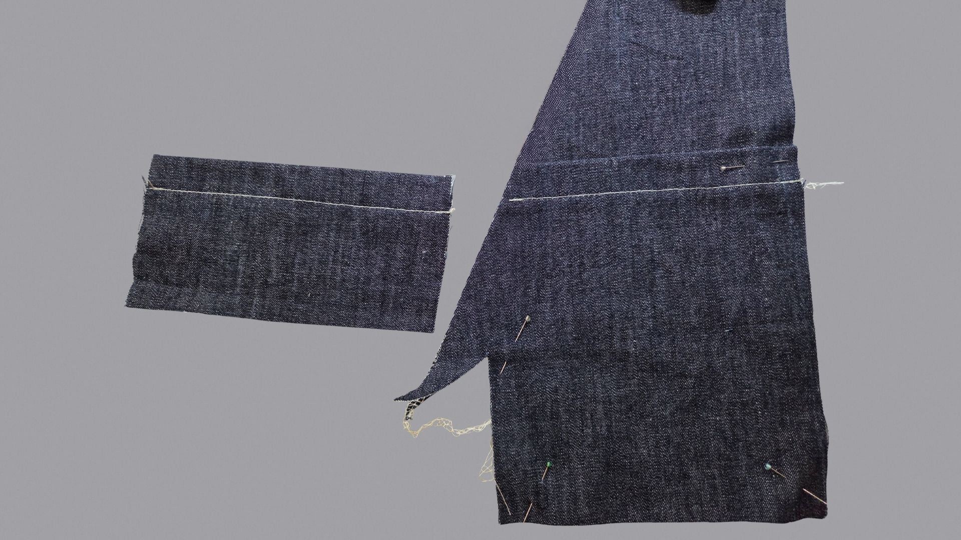 Das Bild zeigt das Absteppen und Stecken der aufgesetzten Taschen.